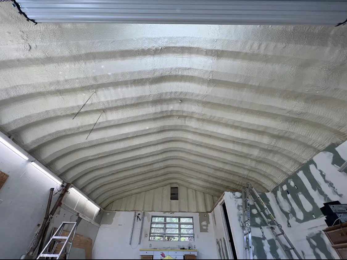 Spray polyurethane foam applied to the underside of a metal roof deck in Sullivan